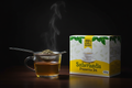 Sutherlandia tea box with tea strainer brewing